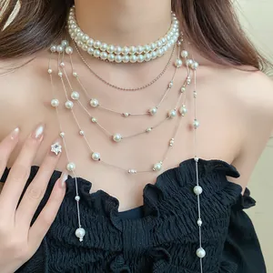 Elegant double-layer pearl choker necklace with multiple long layered tassel chains