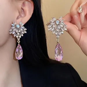 Elegant silver needle flower earrings with sparkling pink teardrop crystal droplets