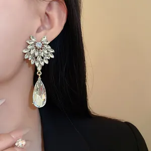 Elegant flower teardrop crystal earrings shown on model for high-end fashion jewelry