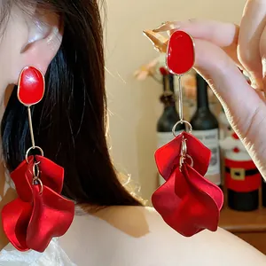 Detailed macro view of elegant red acrylic flower petal drop earrings for stylish women