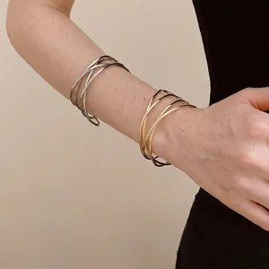 Minimalist multi-layer crossover open bangle set in gold and silver finish
