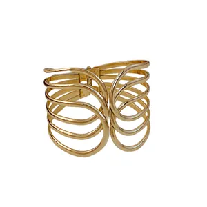 Elegant multi-layered gold cross cuff bracelet with a minimalist metallic open design