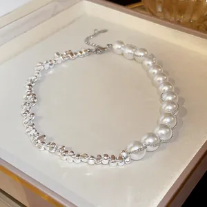 Elegant detail of a French retro silver irregular pearl necklace with asymmetric design