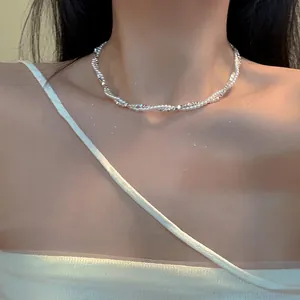 Elegant French vintage silver twisted pearl necklace shown in detail on a model's neck