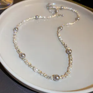 Detailed view of the irregular silver beads and pearls on the elegant French retro necklace