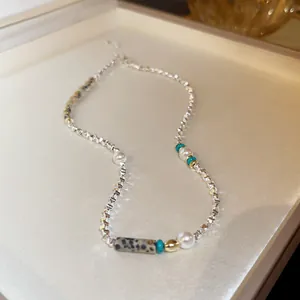 Silver irregular pearl necklace with Dalmatian stone and turquoise beads detail