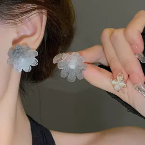 Detailed view of sweet flower stud earrings featuring translucent gradient grey resin petals