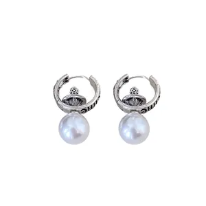 Elegant vintage silver hoop earrings featuring a cross orb design and white pearl drops
