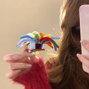 Close-up showing the vibrant colors and fuzzy texture of a unique firework hair clip design