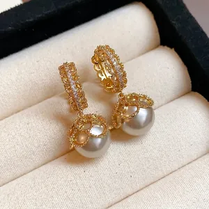 Elegant gold plated zircon lace pearl drop earrings with French vintage style on cream cushion