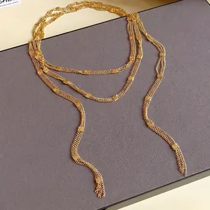Elegant gold multi-layer long chain necklace with textured square accents