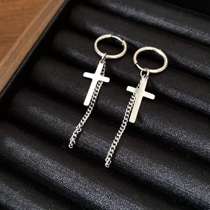 Silver cross hoop earrings with dangling curb chain detail in a black jewelry gift box.