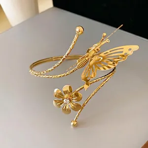 Elegant gold butterfly and flower open bangle bracelet with sparkling rhinestone center