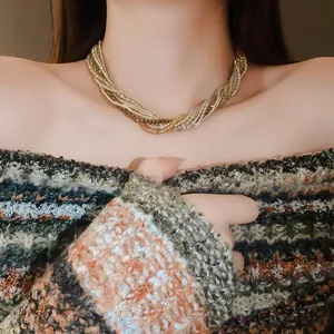 Bohemian multi-layer twisted crystal bead necklace shown on model wearing off-shoulder sweater