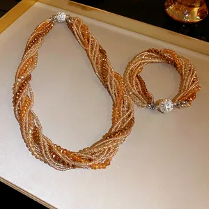 Detailed view of bohemian multi-layer twisted crystal bead necklace and bracelet set