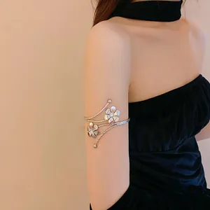 Elegant silver floral arm cuff bracelet with sparkling rhinestones for upper arm jewelry.