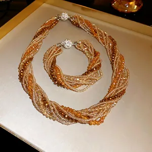 Detailed view of bohemian amber crystal multi-strand necklace and bracelet jewelry set