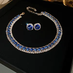 Elegant blue crystal jewelry set featuring a necklace and matching stud earrings
