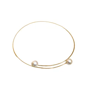 Elegant minimalist gold wire choker necklace featuring two round white pearls for women