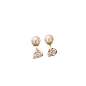 Elegant French vintage pearl and zircon stud earrings with gold-plated silver needles.
