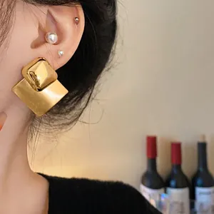 Elegant brushed gold rhombus stud earrings for women in a modern minimalist style