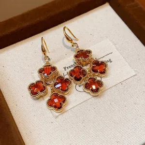 Vintage 18k gold plated flower drop earrings with orange amber-colored zircons