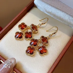 Elegant 18K gold plated four-leaf clover drop earrings with amber zircon crystals