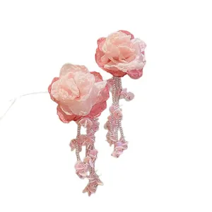 Elegant pink fabric flower earrings with beaded tassels for a forest-inspired look