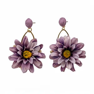 Exquisite purple fabric and raffia flower earrings with golden hoops for elegant vacation style