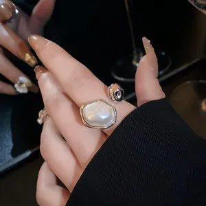 Elegant silver plated adjustable open ring featuring a large irregular white pearl.