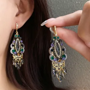 Vintage ethnic teardrop tassel earrings with colorful rhinestones in gold-tone hook style