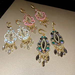 Detailed view of vintage Bohemian rhinestone water drop tassel hook earrings in multiple colors