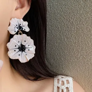 Elegant white ginkgo floral drop earrings with gold accents and forest style design