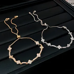 Detailed view of zircon clover adjustable bracelets in rose gold and silver tone