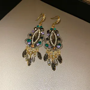 Vintage ethnic style earrings with colorful rhinestones and teardrop tassels detail