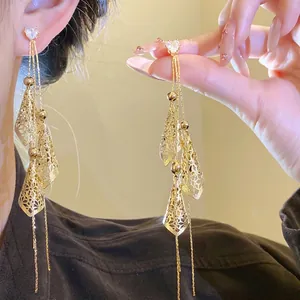 Elegant 18K gold plated long tassel earrings with zircon and intricate hollow design