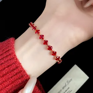 Detailed macro view of vintage red square zircon bracelet with elegant gold finish