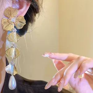 Elegant 18K gold-plated tiered floral earrings with teardrop pearl and zircon accents