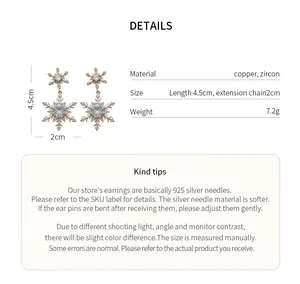 Detailed macro view of snowflake earrings with zircon stones and dimensions information