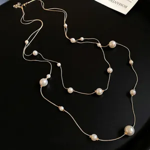 French vintage double-layered necklace with asymmetric pearls on elegant gold chain