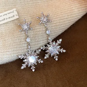 Detailed view of sparkling zirconia snowflake drop earrings perfect for winter elegance