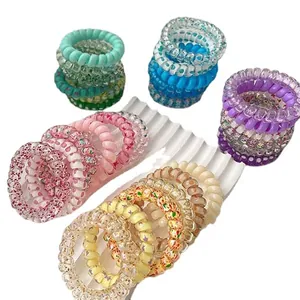 Set of six colorful spiral telephone wire hair ties with sweet candy floral patterns