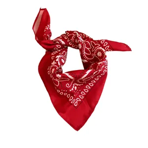 Red bandana with white sunflower paisley print tied in a knot on white background