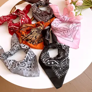 Collection of various colored paisley print bandanas showing intricate floral patterns