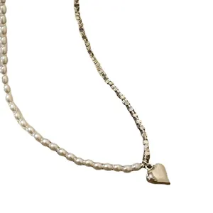Minimalist silver heart pendant necklace with elegant pearl and box chain stitching design
