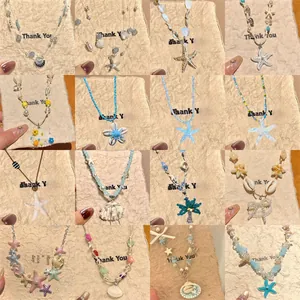 Damen Urlaubsstil Legierung Künstliche Perlenkette Ozean Seestern Meerschnecke Anhänger Handgefertigt Sommer Strand Choker Schmuck