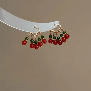 Vintage Chinese style beaded earrings with red and green beads on gold buckle