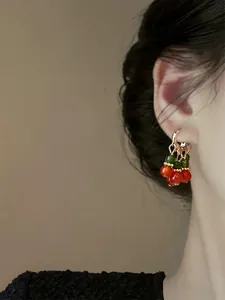 Elegant retro Chinese style beaded cherry earrings shown on a model for daily wear