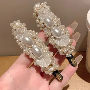 Vintage elegant pearl petal duckbill hair clips with handmade gold tag detail for women