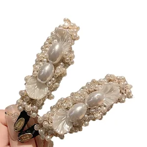 Vintage style pearl and petal hair clips set for elegant hair styling accessory